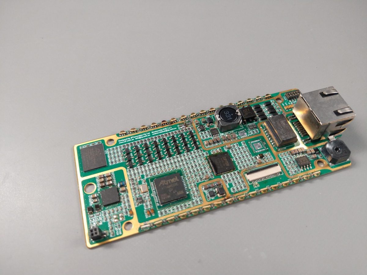 A green circuit board with an Ethernet jack, radio module, microcontroller and antenna matching section.